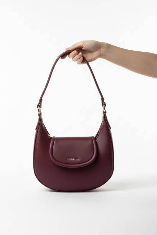 Burgundy Chrisbella hobo bag carried by hand