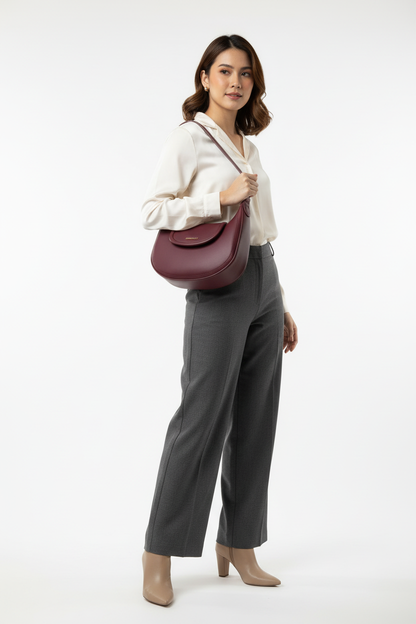 Filipina model with burgundy hobo bag under arm with short strap